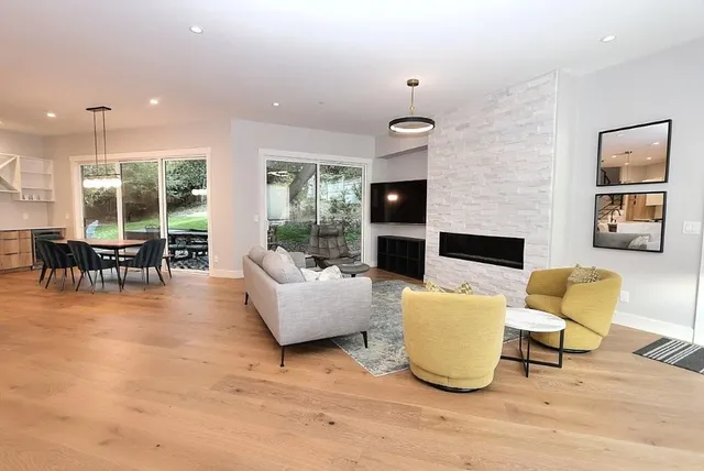 a view of a dining room with furniture window and wooden floor