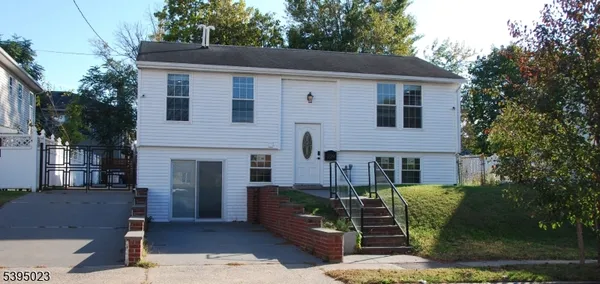 a front view of a house with garage