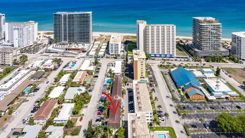 an aerial view of residential building and lake