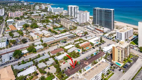 an aerial view of city and lake