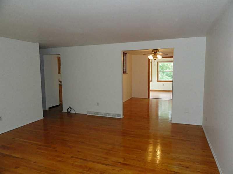 456 Tivoli Road Plum, PA 15239 - Photo 2 of 21 Living Room. The living room leads to the dining room and the sunny family room.