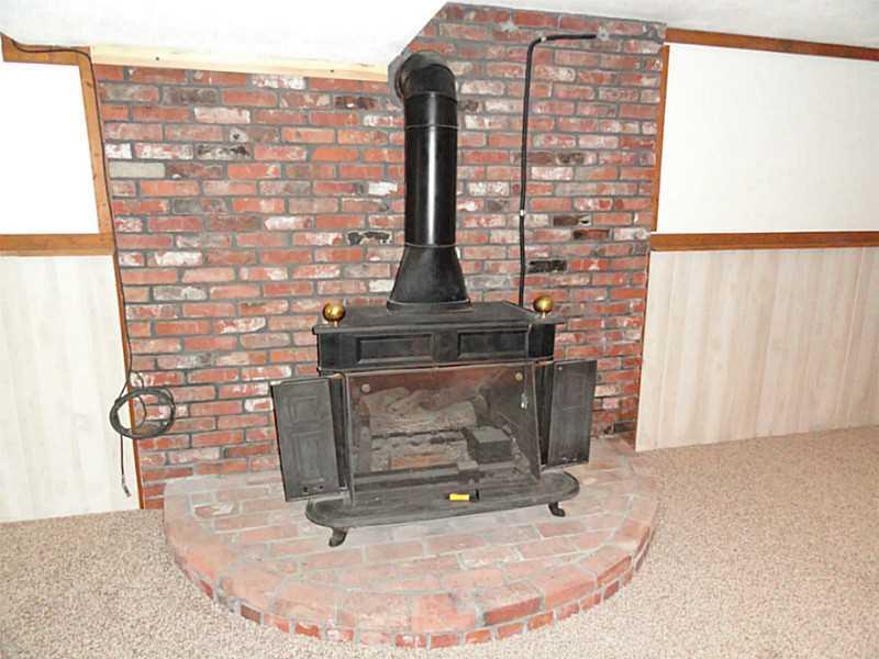 456 Tivoli Road Plum, PA 15239 - Photo 15 of 21 Basement/Game Room. The gas powered Franklin stove will keep you warm and cozy on cold winter evenings.