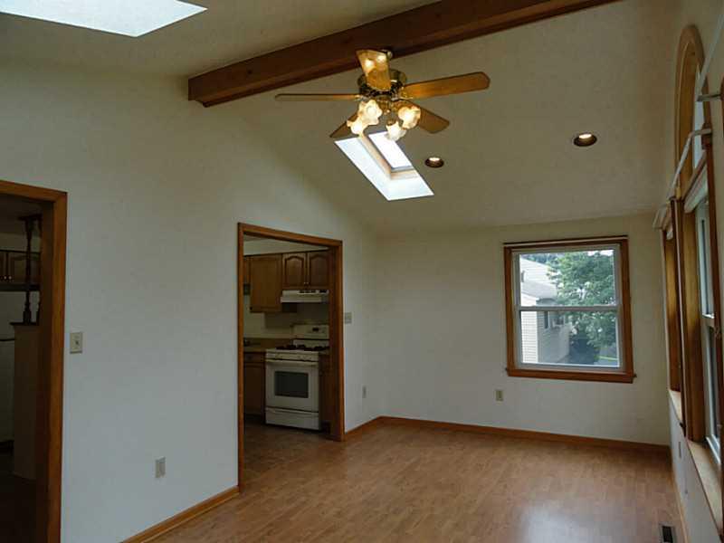 456 Tivoli Road Plum, PA 15239 - Photo 10 of 21 Family Room. The vaulted family room is accessible from the kitchen and dining room.
