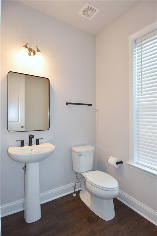 122 Gress Road Cranberry Township, PA 16066 - Photo 14 of 33 a bathroom with a toilet sink and mirror