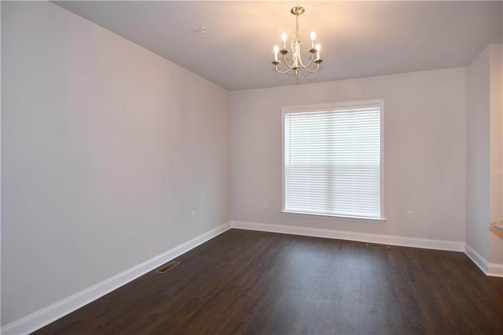122 Gress Road Cranberry Township, PA 16066 - Photo 16 of 33 an empty room with wooden floor and windows