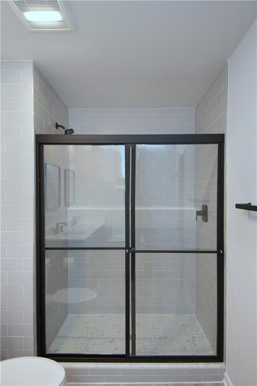 122 Gress Road Cranberry Township, PA 16066 - Photo 33 of 33 a bathroom with a glass shower door