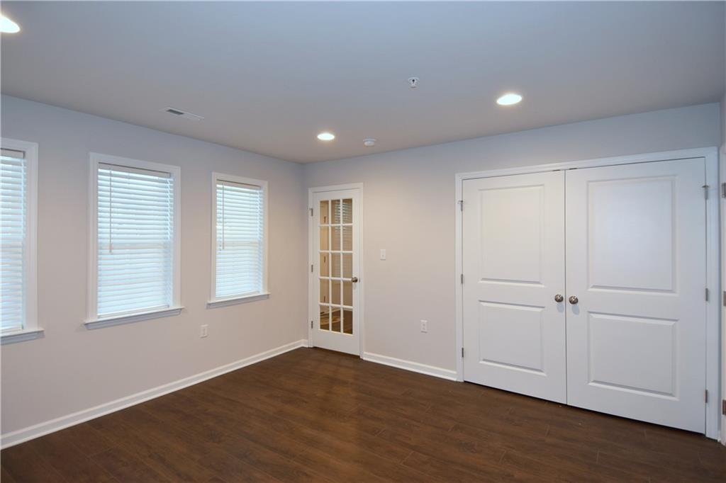 122 Gress Road Cranberry Township, PA 16066 - Photo 7 of 33 an empty room with wooden floor and windows