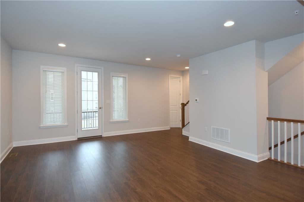 122 Gress Road Cranberry Township, PA 16066 - Photo 9 of 33 a view of an empty room with wooden floor and a window