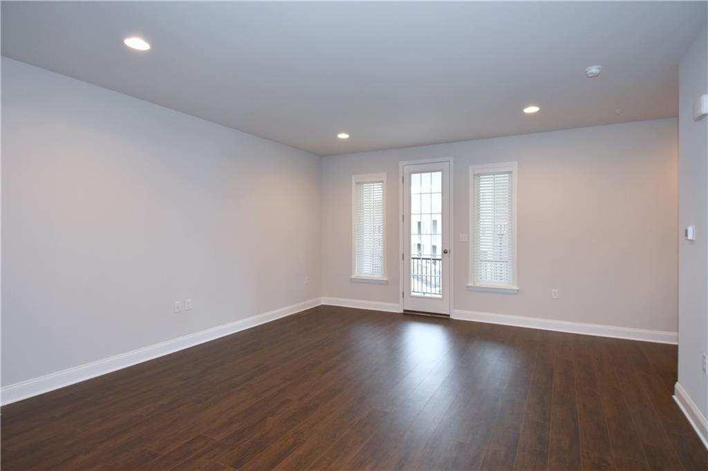 122 Gress Road Cranberry Township, PA 16066 - Photo 10 of 33 a view of an empty room with wooden floor and window