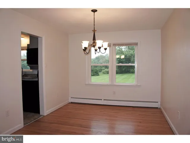 a view interior of a house with wooden floor outdoor space and windows