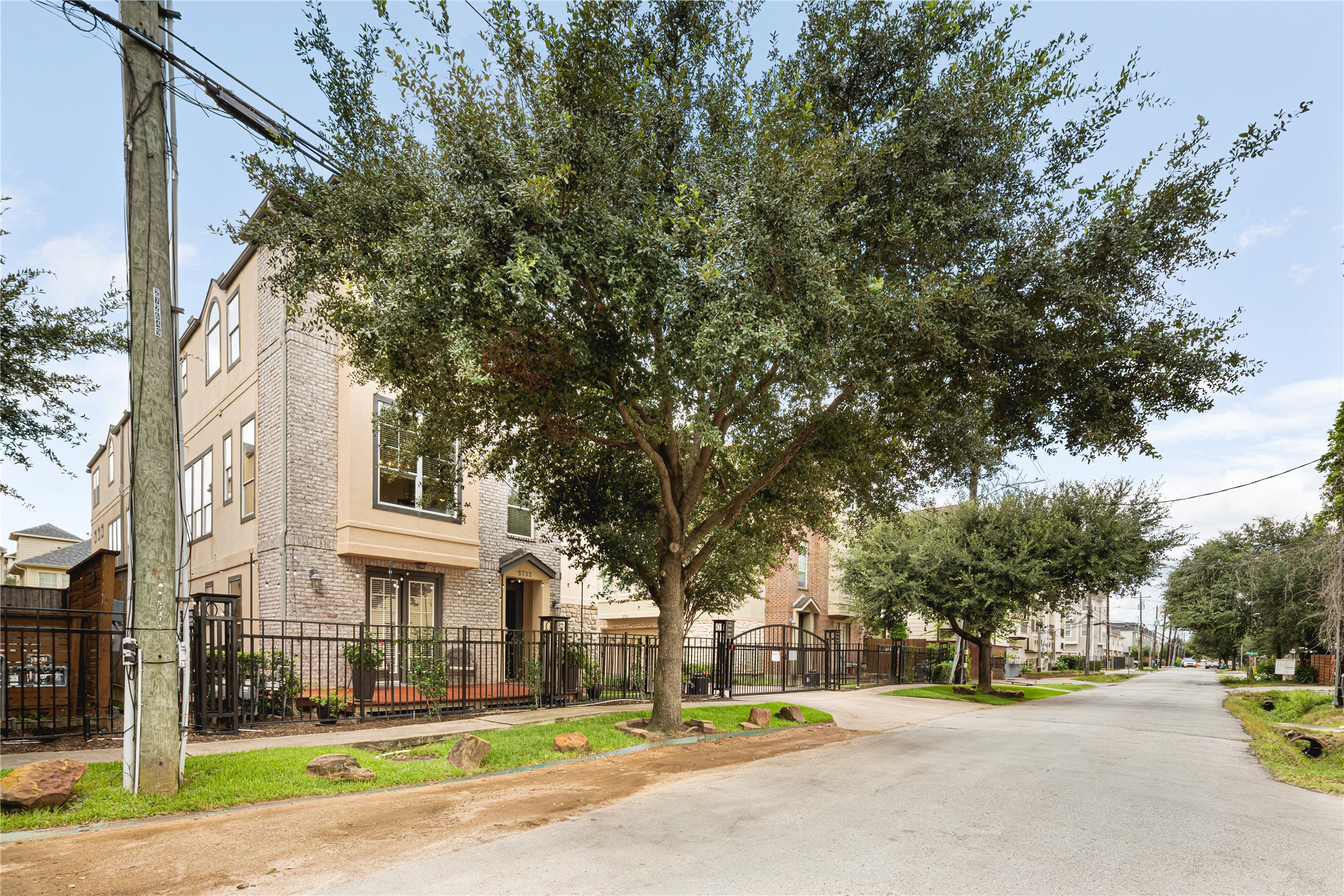 5733 Kansas Street Houston, TX 77007 - Photo 1 of 36 a view of road with trees