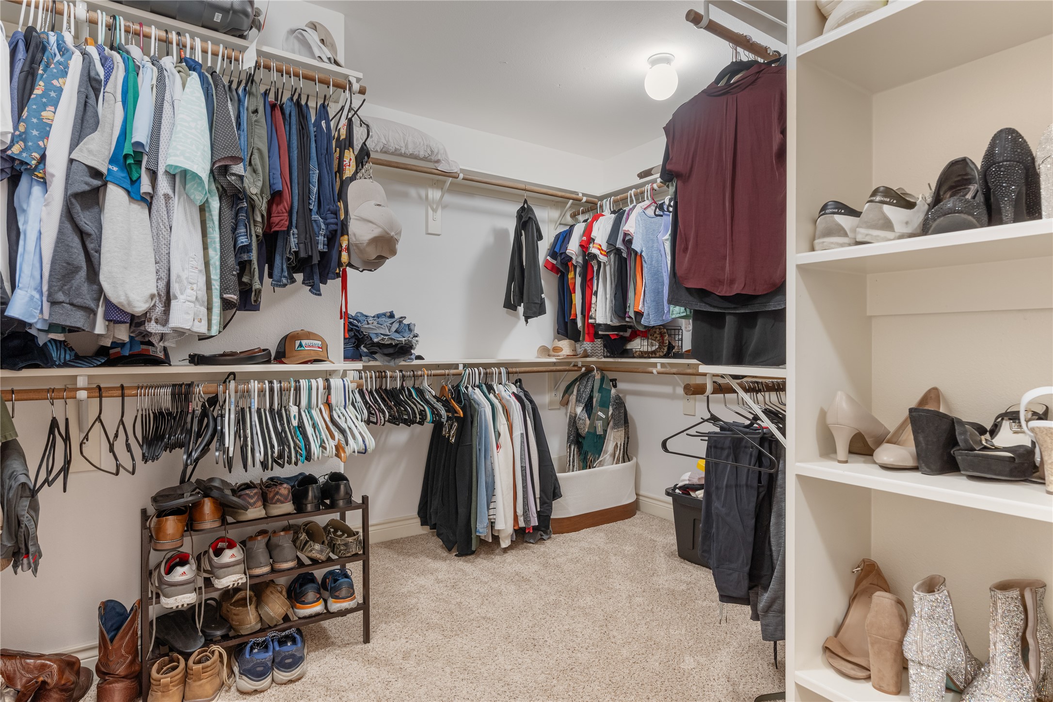 5733 Kansas Street Houston, TX 77007 - Photo 15 of 36 a view of walk in closet with clothes and shoes
