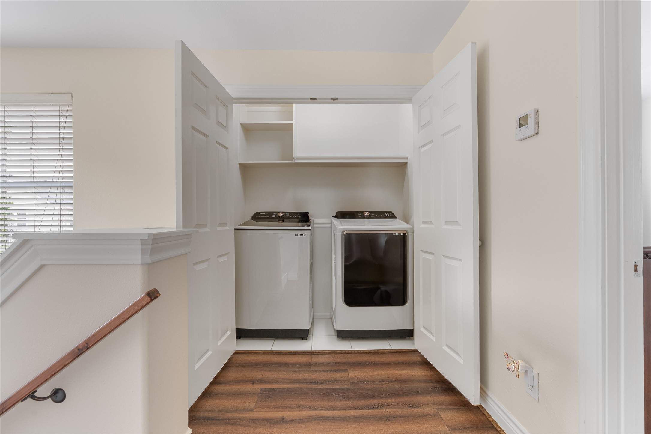 5733 Kansas Street Houston, TX 77007 - Photo 23 of 36 a view of a kitchen with sink dishwasher and wooden floor