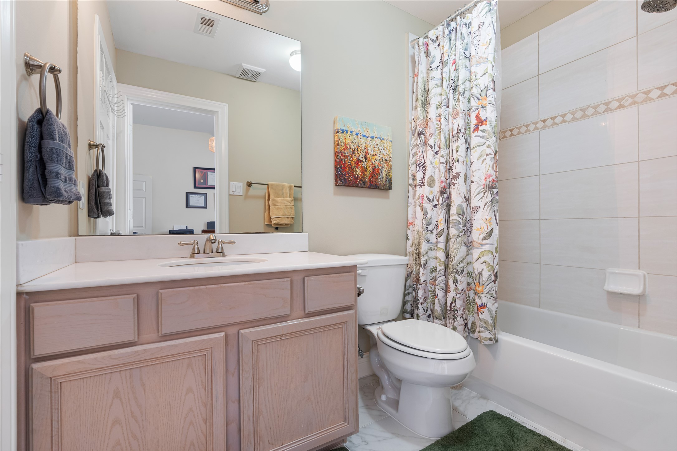 5733 Kansas Street Houston, TX 77007 - Photo 35 of 36 a bathroom with a toilet sink vanity tub and shower