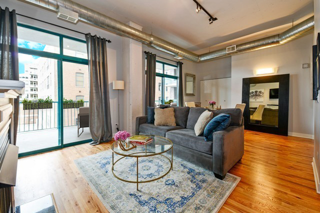 910 West Madison Street, Unit 501 Chicago, IL 60607 - Photo 3 of 11 a living room with furniture and a large window