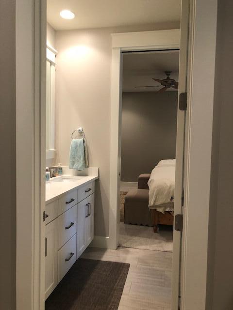 103 Jack Knife Drive Watersound, FL 32461 - Photo 22 of 24 a en suite bathroom with a granite countertop sink and a mirror