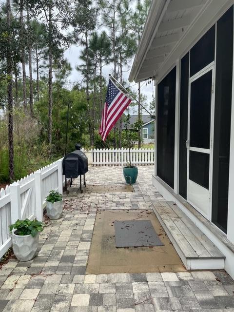 103 Jack Knife Drive Watersound, FL 32461 - Photo 5 of 24 a bench sitting in front of a building