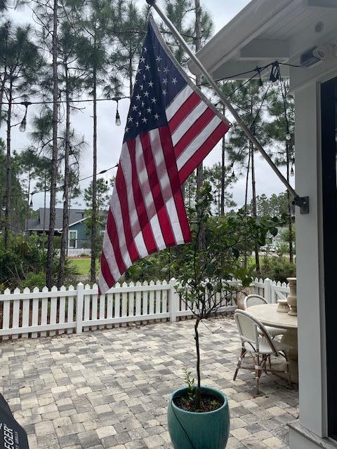 103 Jack Knife Drive Watersound, FL 32461 - Photo 6 of 24 a view of a chairs and tables in patio