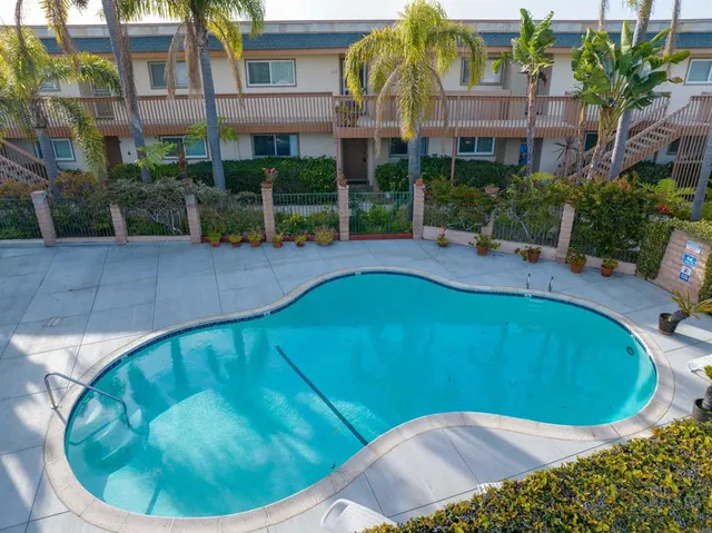 a view of a swimming pool with a patio