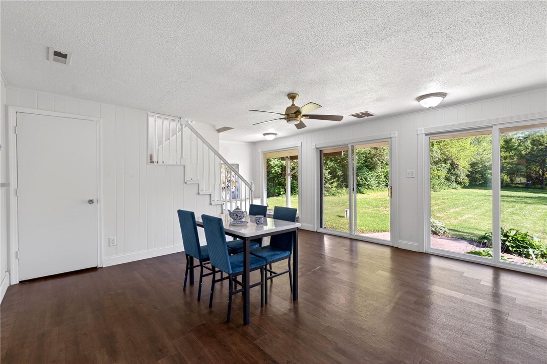2684 Arthur Road Springfield, OH 45502 - Photo 20 of 69 This inviting space features rich flooring, leading to a vibrant outdoor setting.