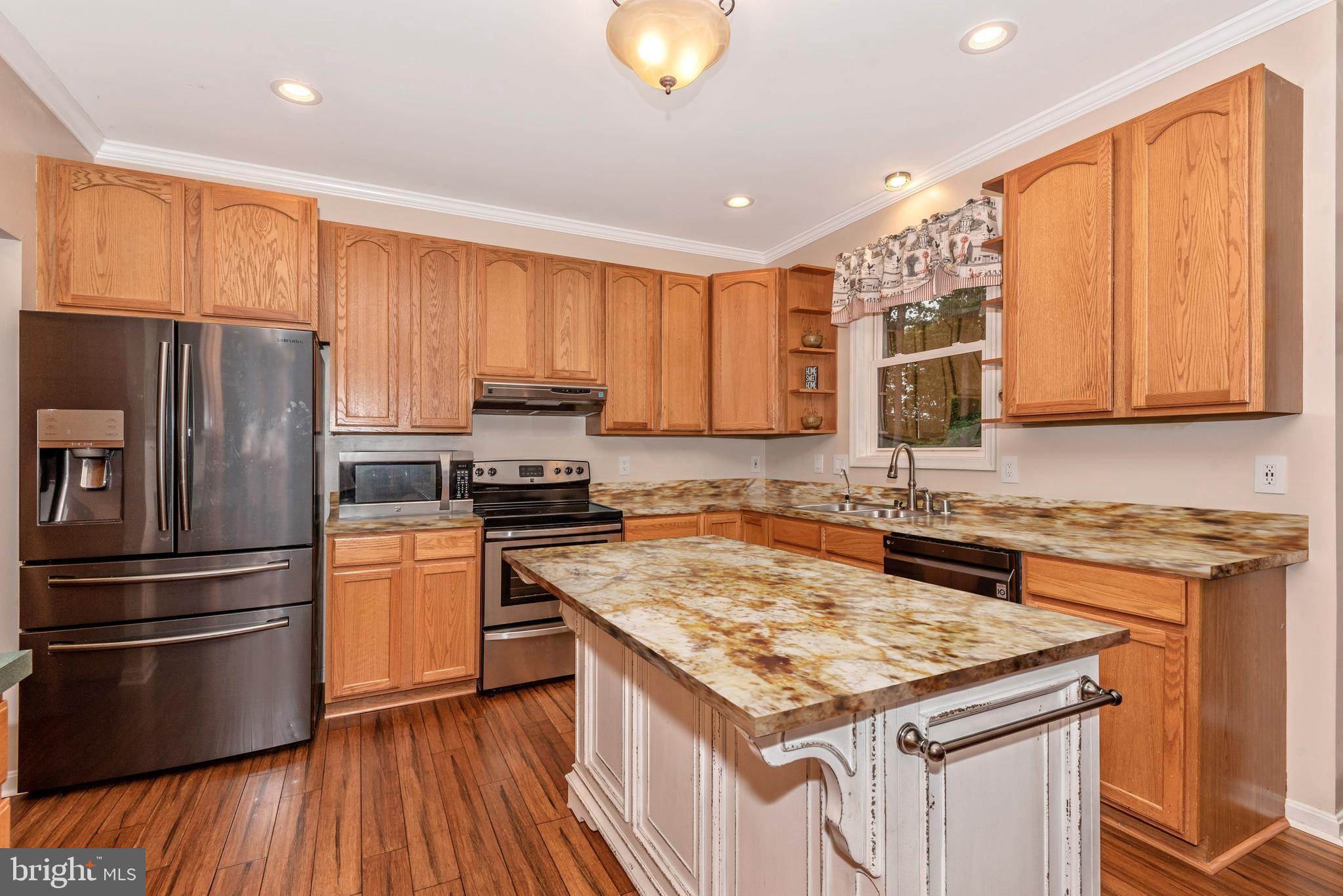3522 Hooper Road New Windsor, MD 21776 - Photo 7 of 43 a kitchen with granite countertop a sink stove and refrigerator