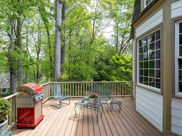 a view of balcony with furniture and wooden deck