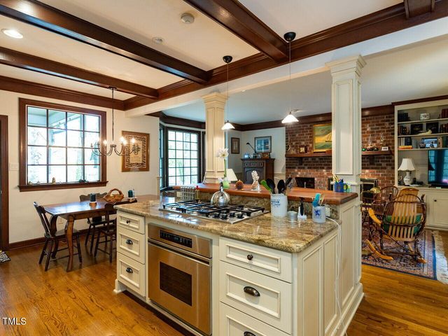 a kitchen with stainless steel appliances granite countertop a stove and a cabinets
