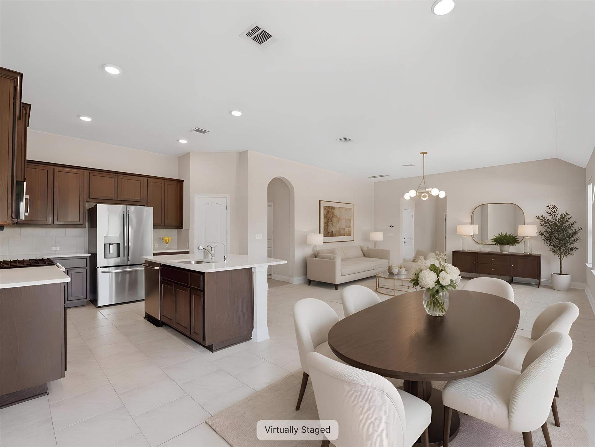2132 Ringstaff Road Leander, TX 78641 - Photo 4 of 39 An open concept design seamlessly connects a modern kitchen to a comfortable living area.