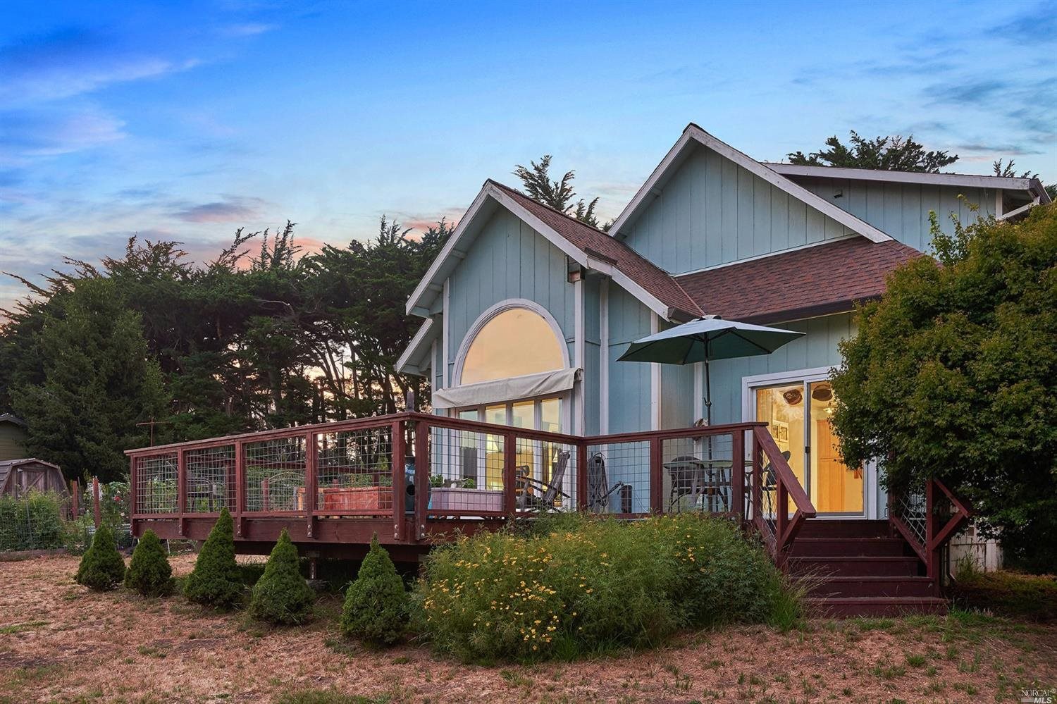 350 Mesa Road Point Reyes Station, CA 94956 - Photo 1 of 1 a front view of a house with garden