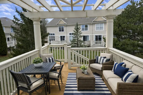 a view of a balcony with furniture