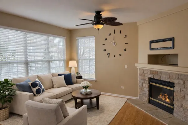 a living room with furniture and a fireplace