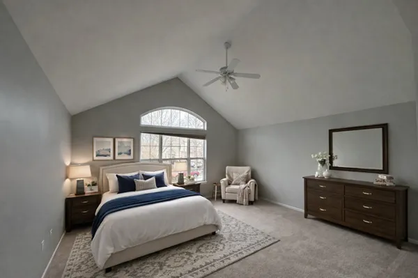 a bedroom with a bed and window