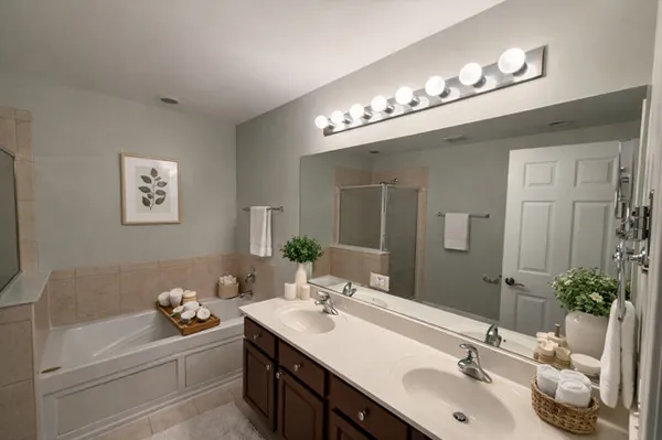 a bathroom with a sink double vanity and a mirror
