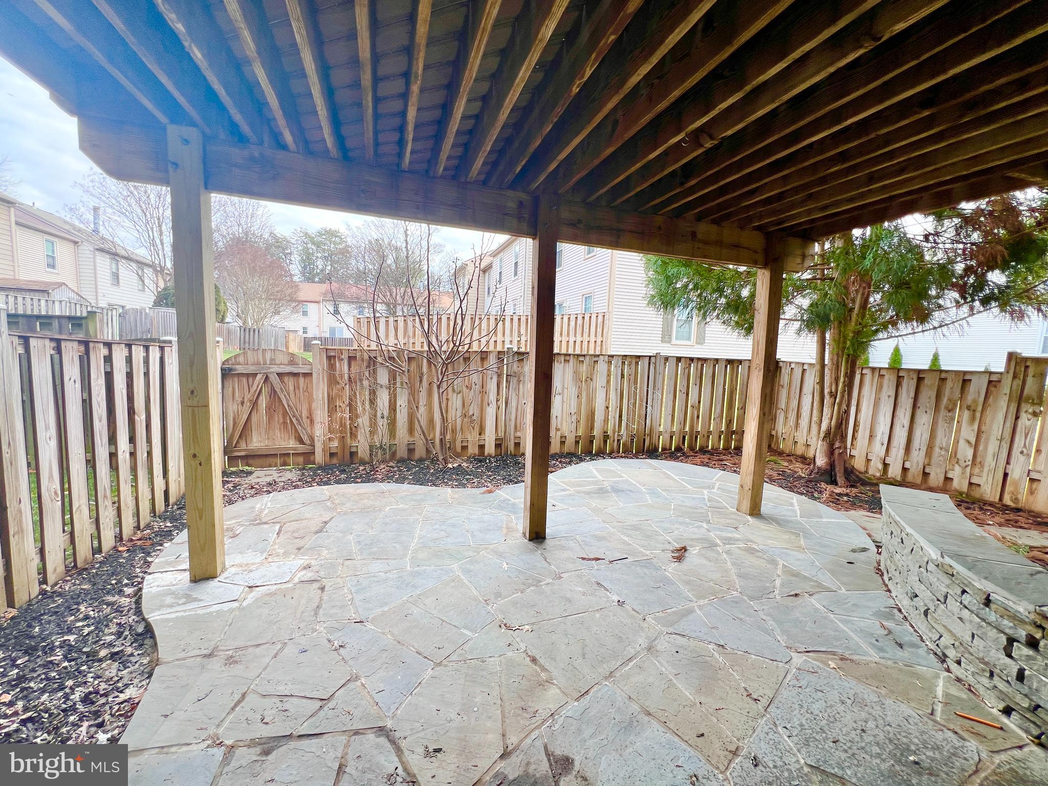 10287 Latney Road Fairfax, VA 22032 - Photo 25 of 26 a view of backyard with large trees and wooden fence