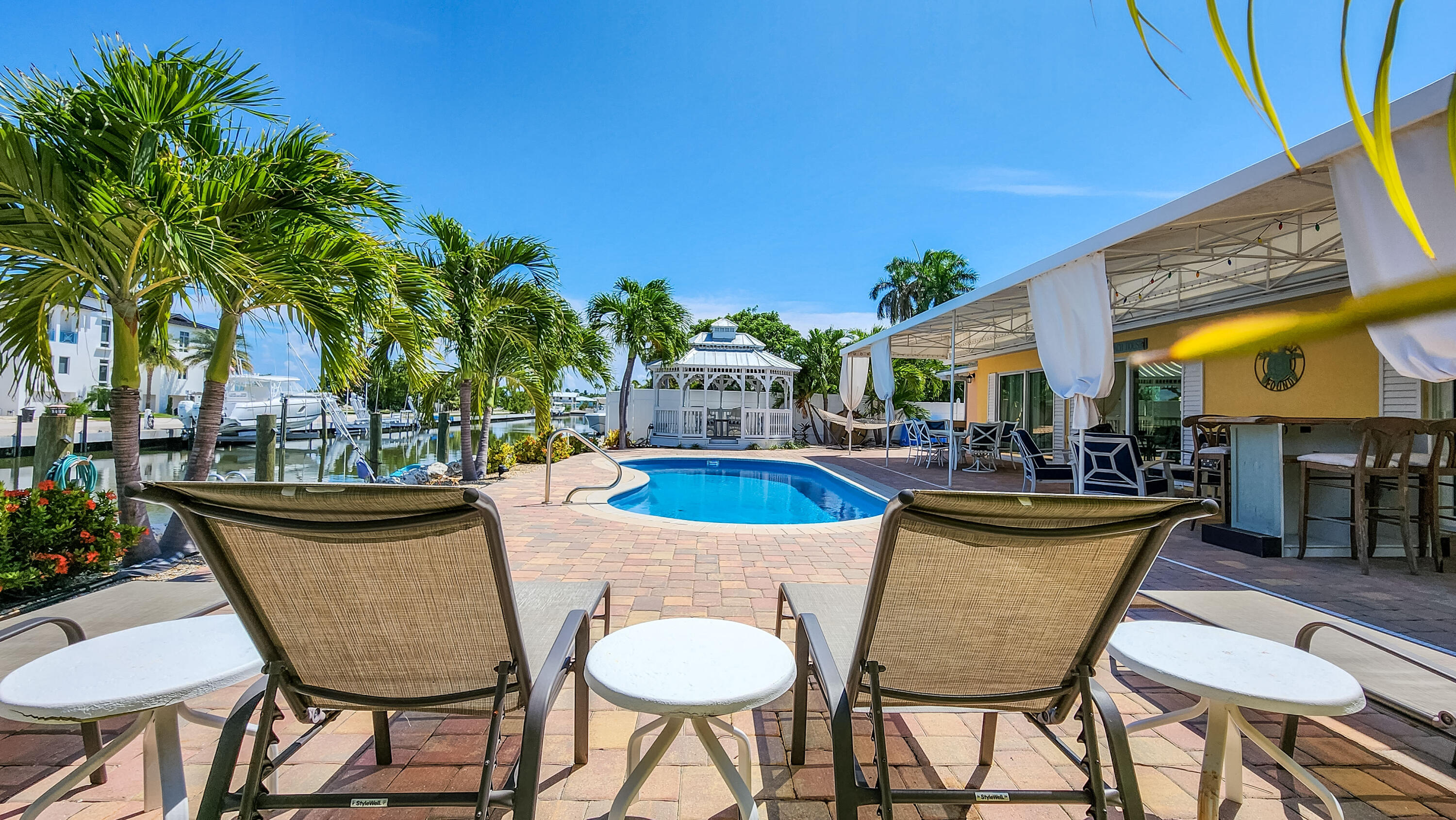 Canal home with a pool gazebo docks ocea