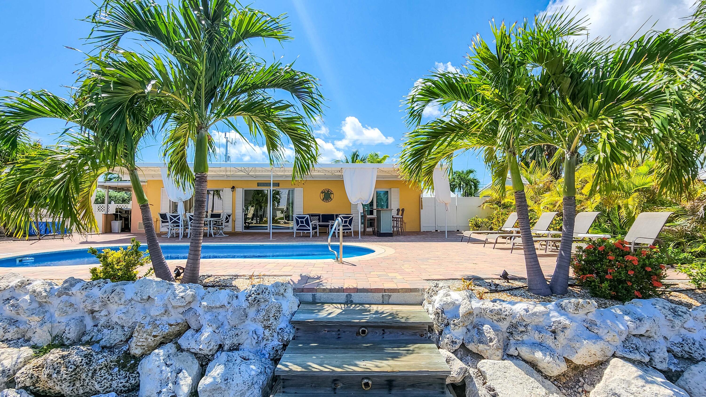 Canal home with a pool gazebo docks ocea