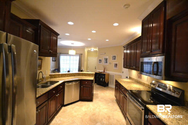 1640 Augusta Drive West Mobile, AL 36695 - Photo 4 of 25 Beautiful kitchen with custom cabinets, new granite and new stainless steel appliances.