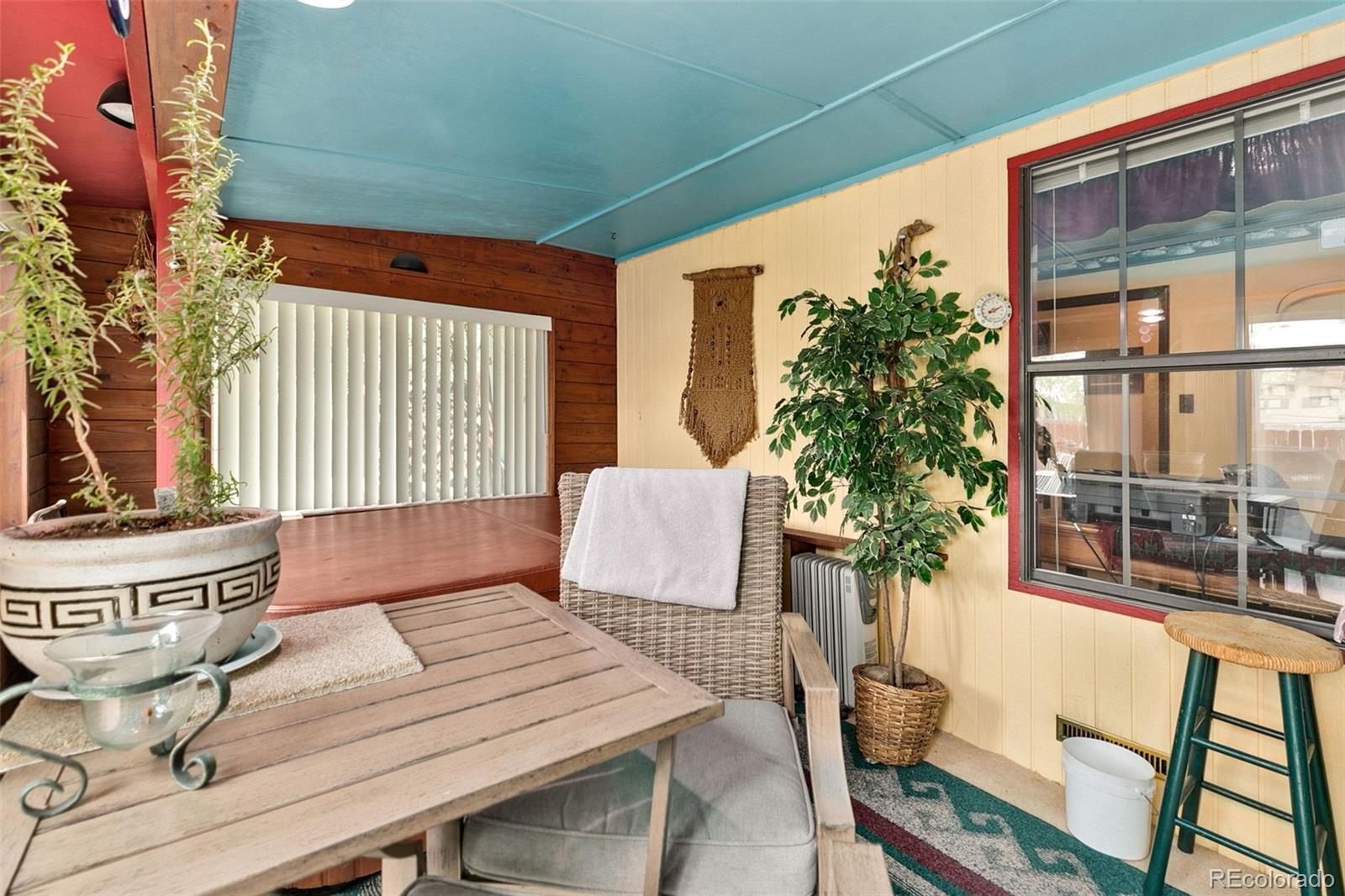 13 Maple Drive Frederick, CO 80530 - Photo 11 of 32 a view of a patio with table and chairs and potted plants