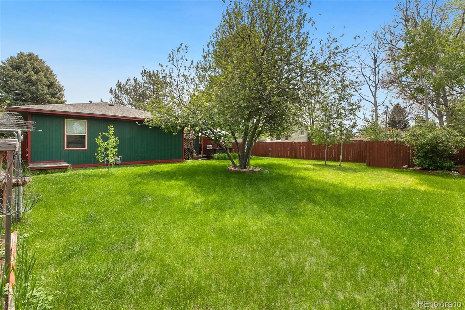 13 Maple Drive Frederick, CO 80530 - Photo 25 of 32 a view of a house with a yard