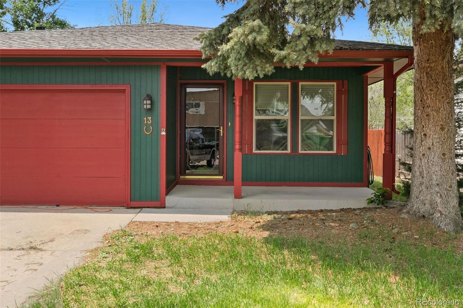 13 Maple Drive Frederick, CO 80530 - Photo 32 of 32 a front view of a house with a yard