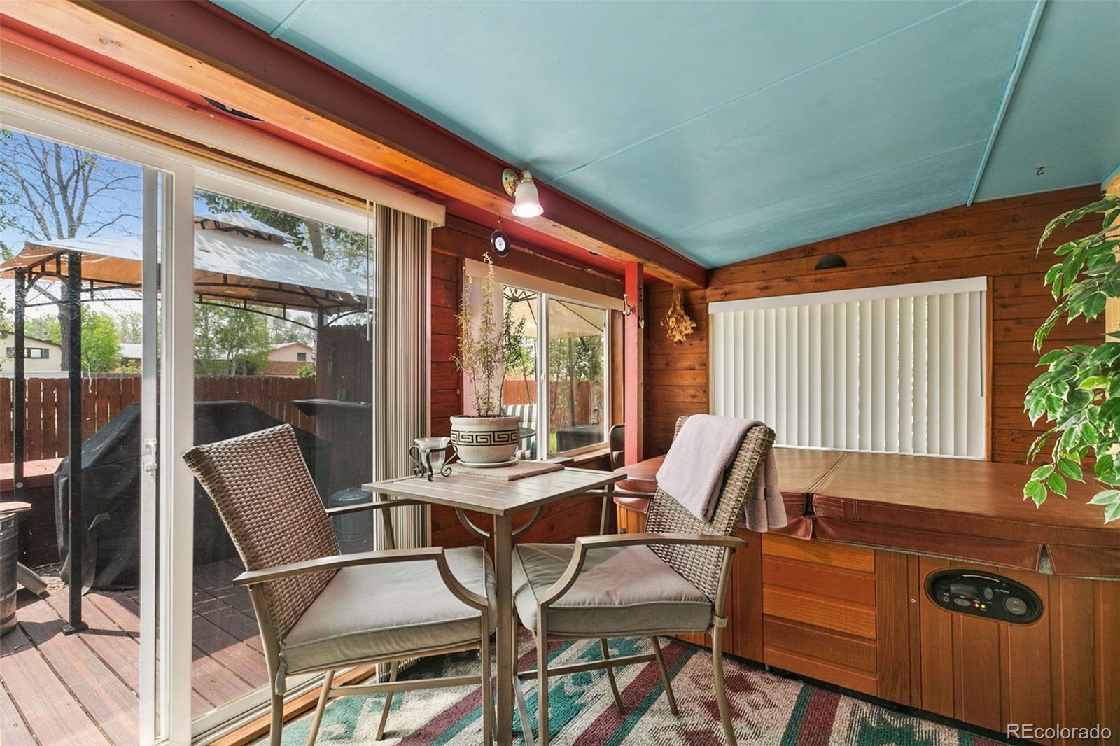 13 Maple Drive Frederick, CO 80530 - Photo 10 of 32 a view of a patio with table and chairs and potted plants