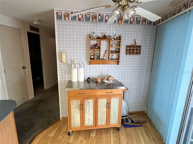 a kitchen with a sink appliances and cabinets
