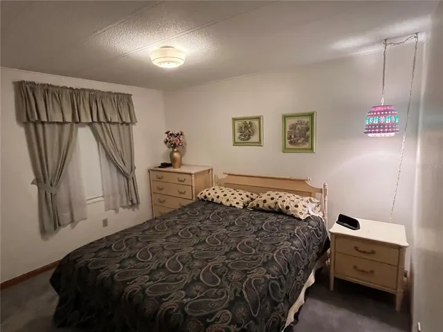 a bedroom with a bed and a cabinets