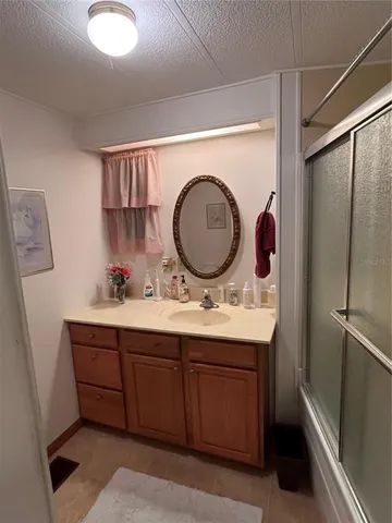 a bathroom with a tub and a sink