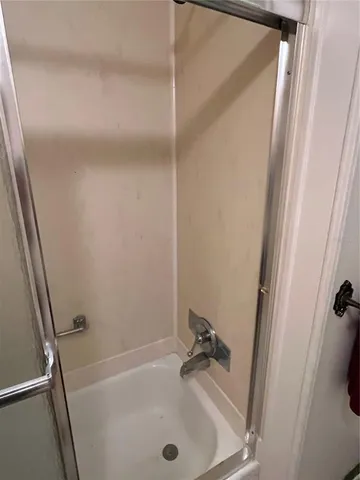 a bed room with a bed and a television