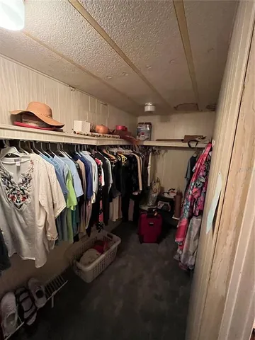 a bathroom with a toilet and a shower curtain