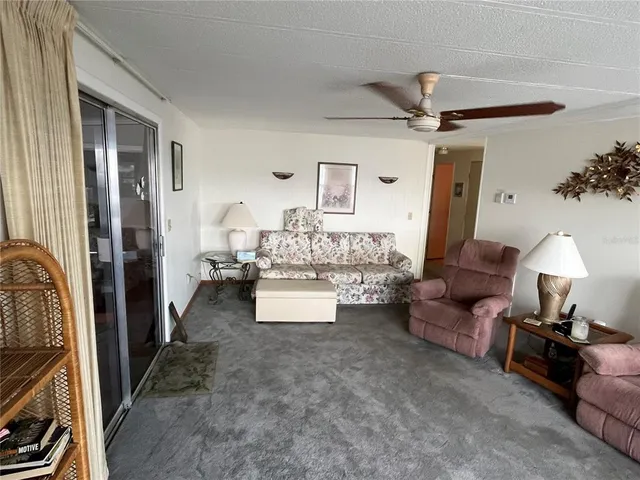 a kitchen with a sink and wooden floor