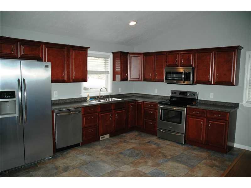 290 Lagonda Road Washington, PA 15301 - Photo 4 of 10 Kitchen. The kitchen has stainless steel appliances, ceramic tile floors and spots.