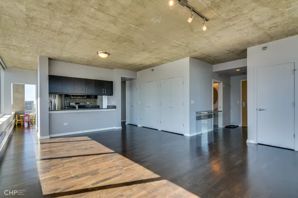 a kitchen with granite countertop a stove and a sink