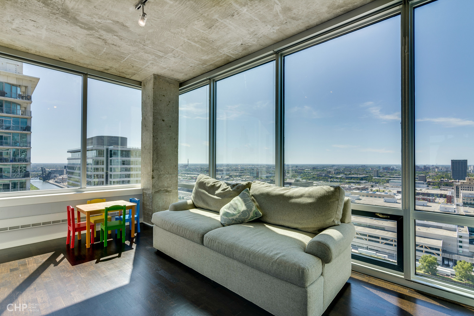 611 South Wells Street, Unit 2907 Chicago, IL 60607 - Photo 7 of 16 a living room with furniture and floor to ceiling windows